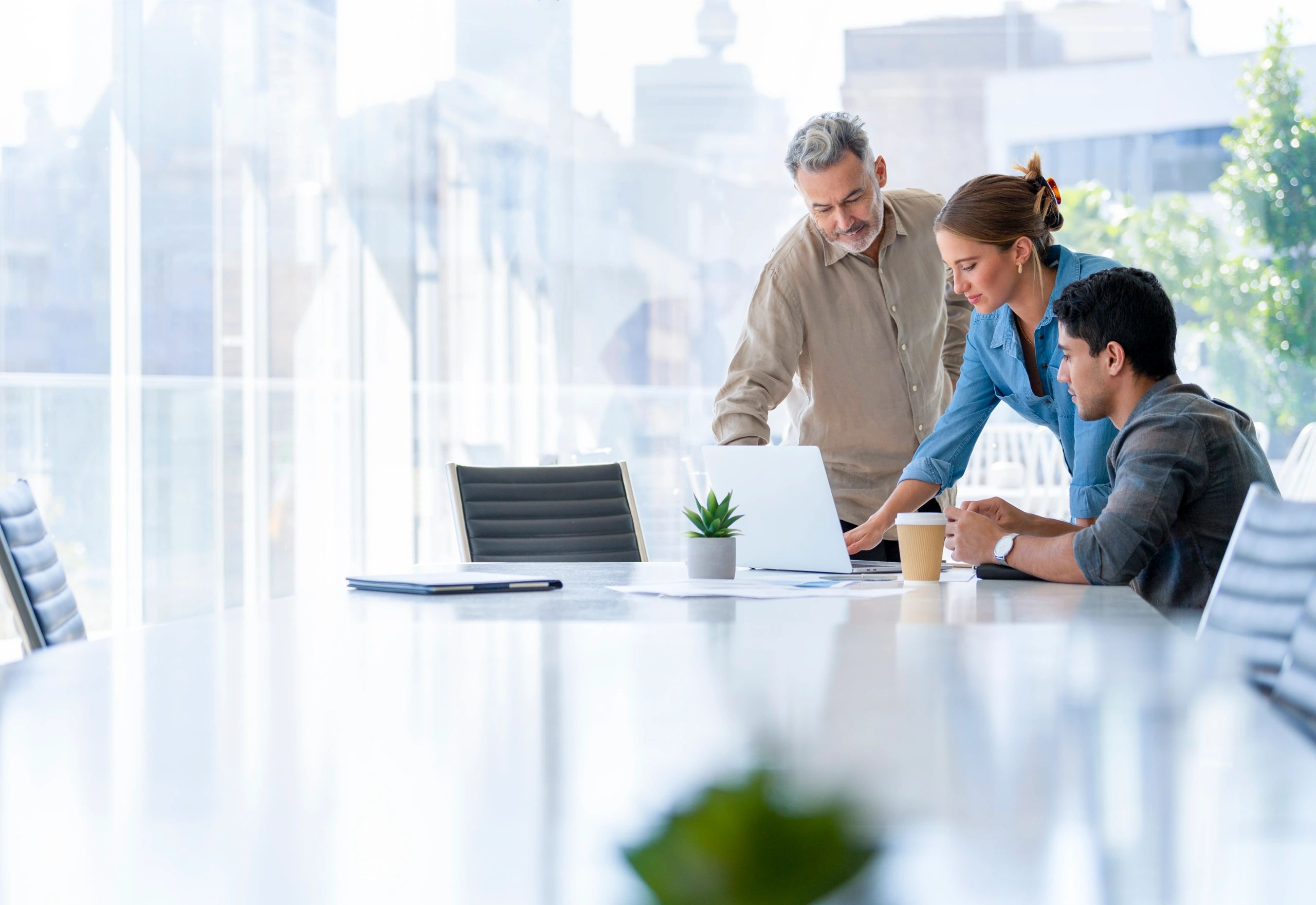Team reviewing work together in a boardroom