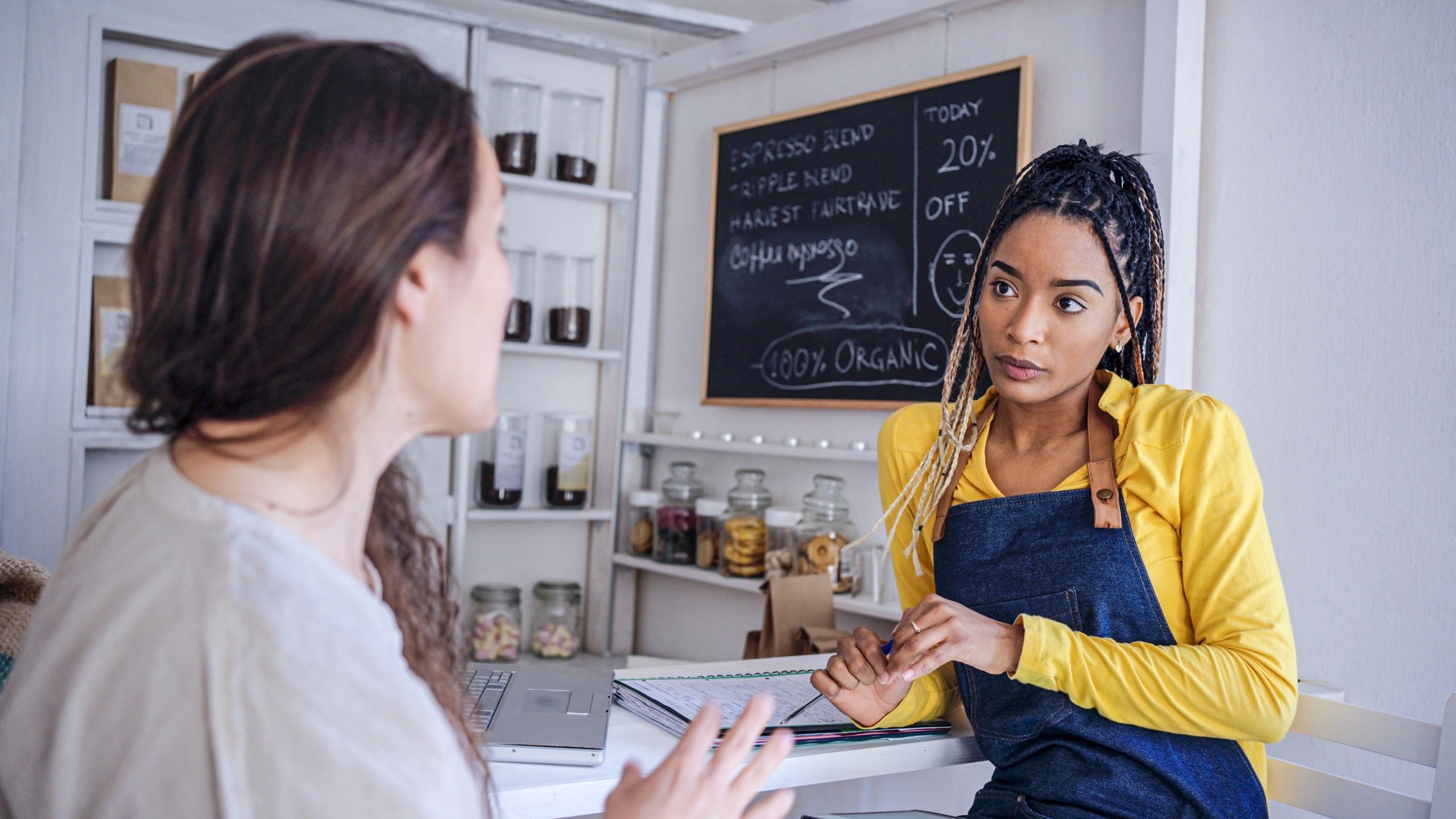 Small business owner in a coffee shop setting
