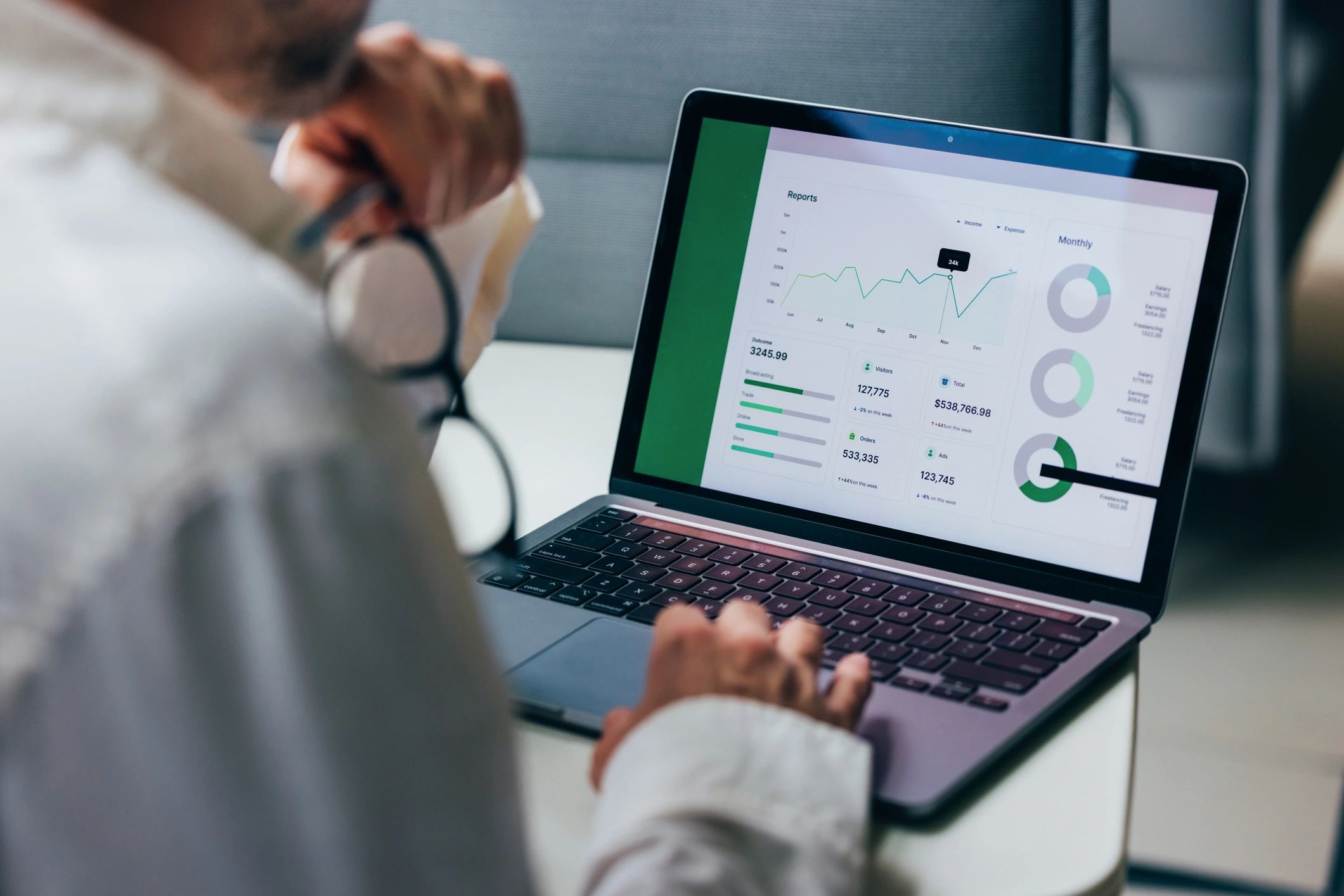 Professional analyzing performance data on a laptop for SEO insights