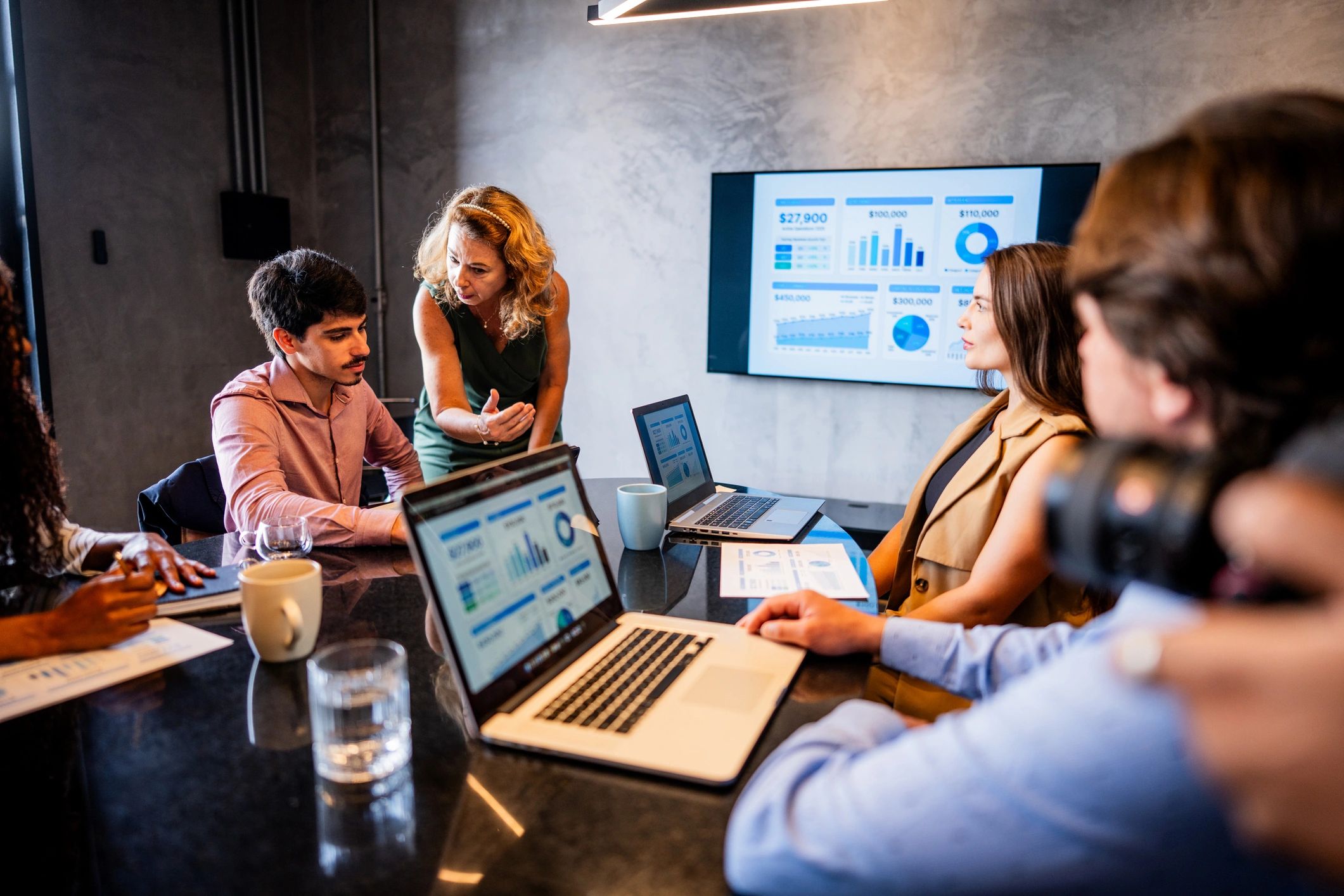 Coworkers talking during a meeting in an office